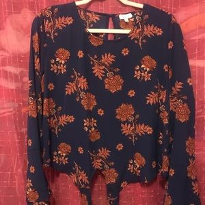 Patterned top with bell bottom sleeves